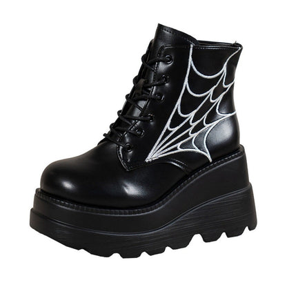 Bottes femme noires à lacets avec semelle compensée et motif toile d’araignée